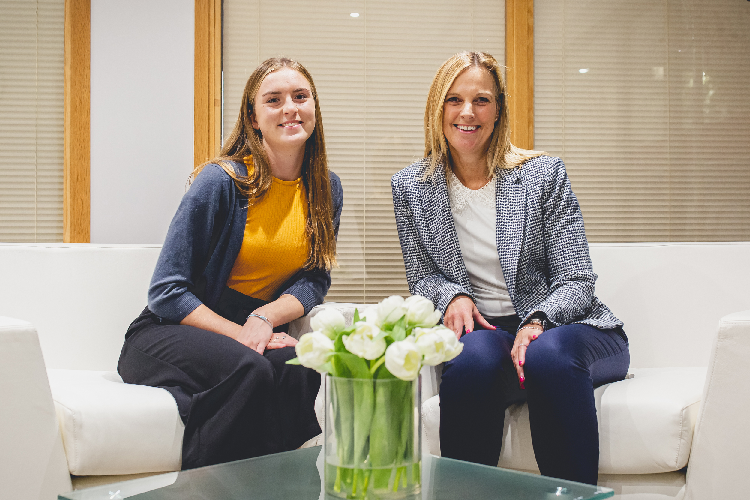 Sharon Coburn sitting with bursary student Sophie De Garis 