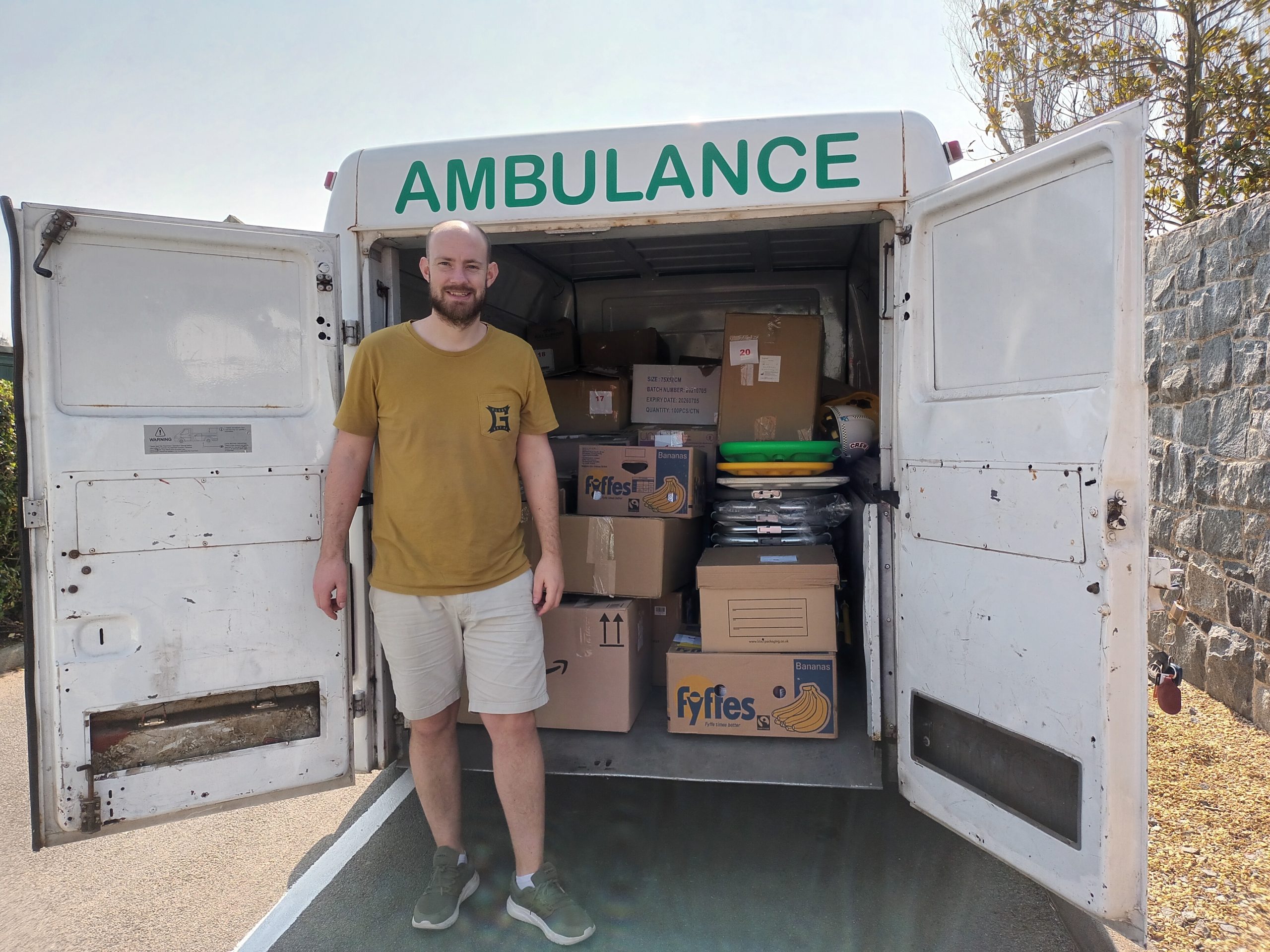 Darren-Konken stood next to Ukraine ambulance