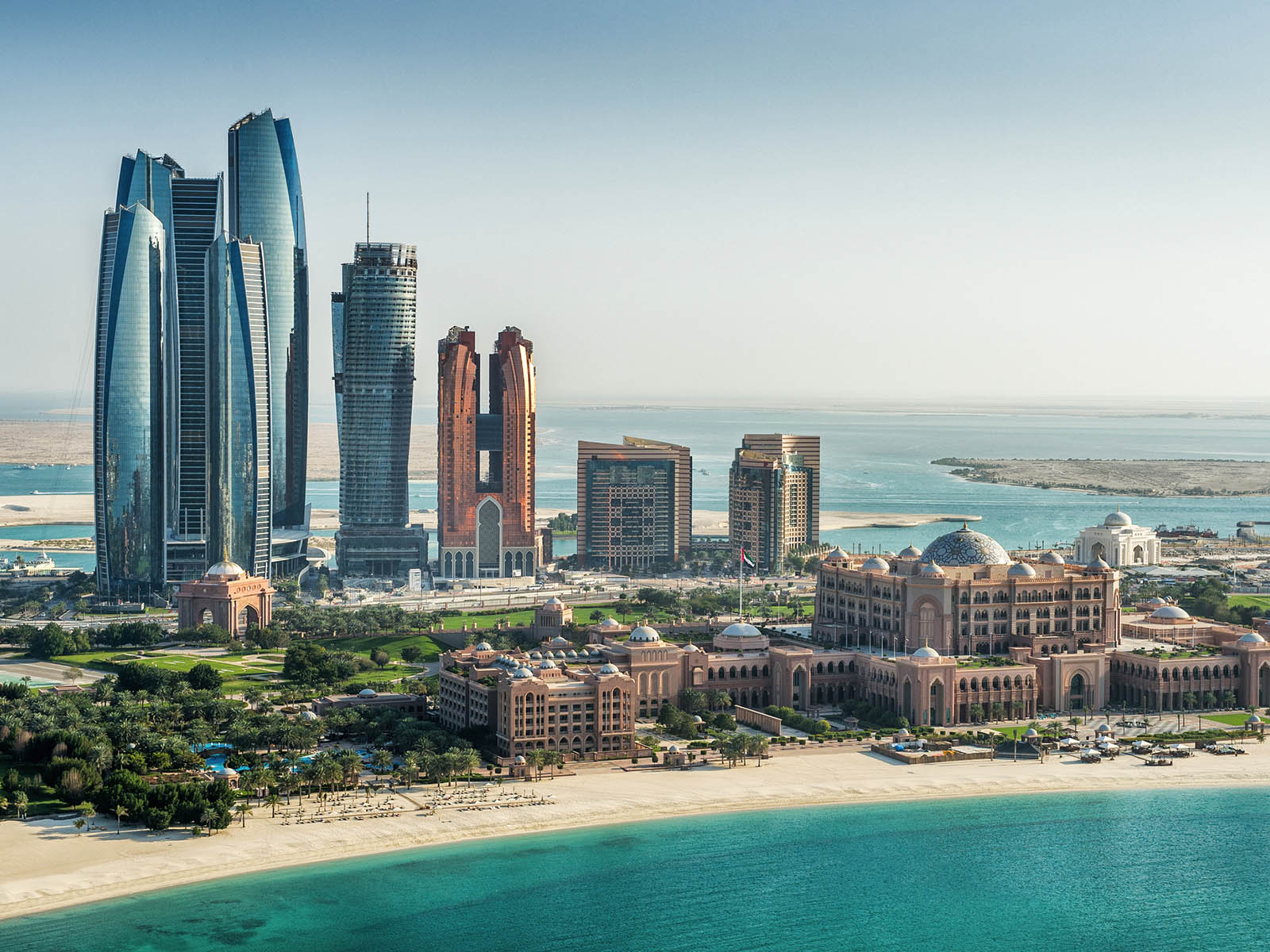 The beach with many skyscrapers in the background