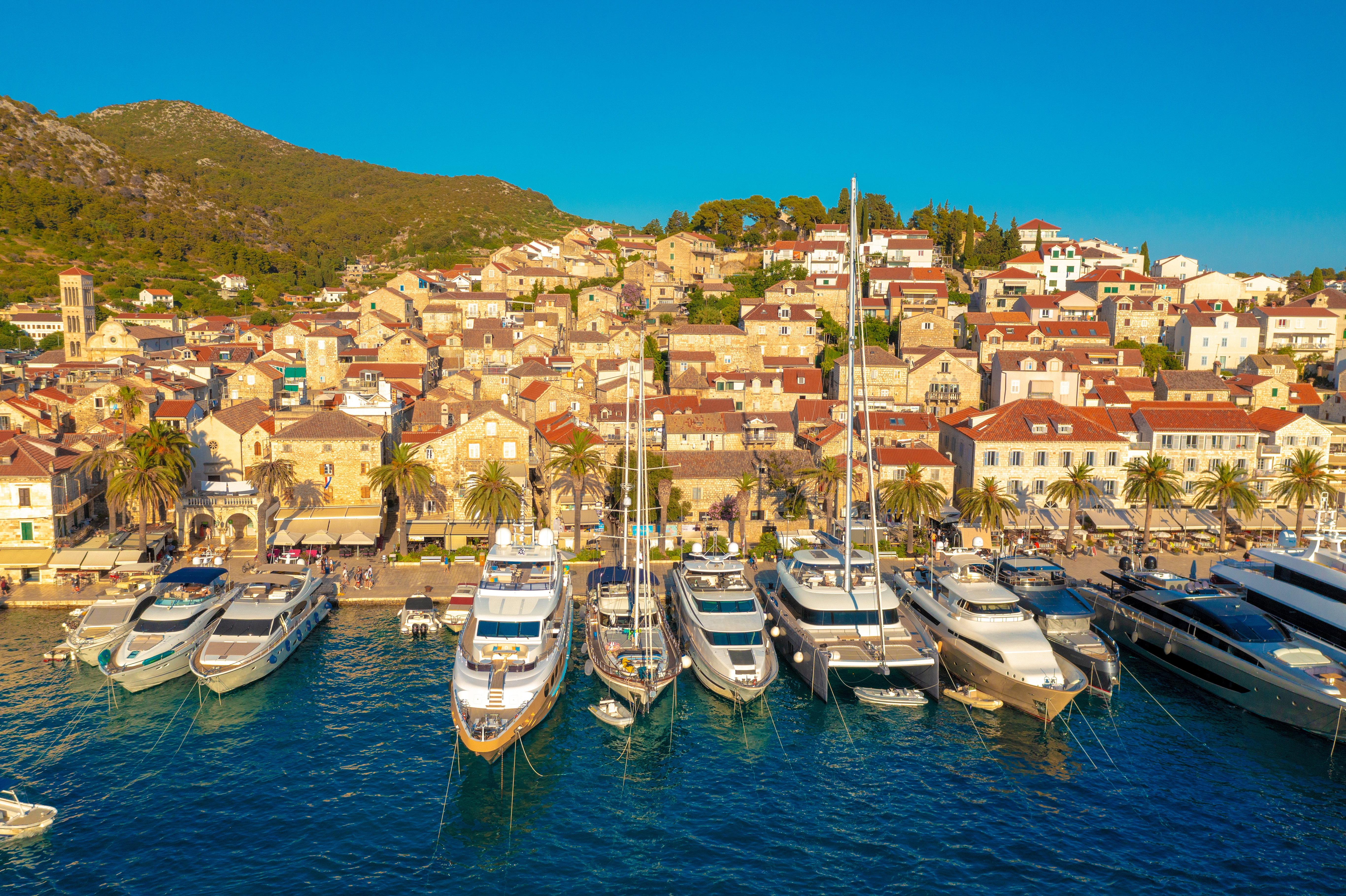 Superyachts in a marina at sunset