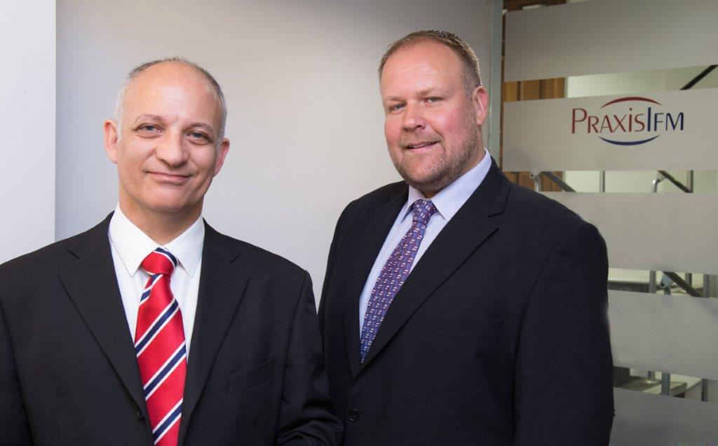 David Stephenson and Graham Dawson standing side by side in the Guernsey office