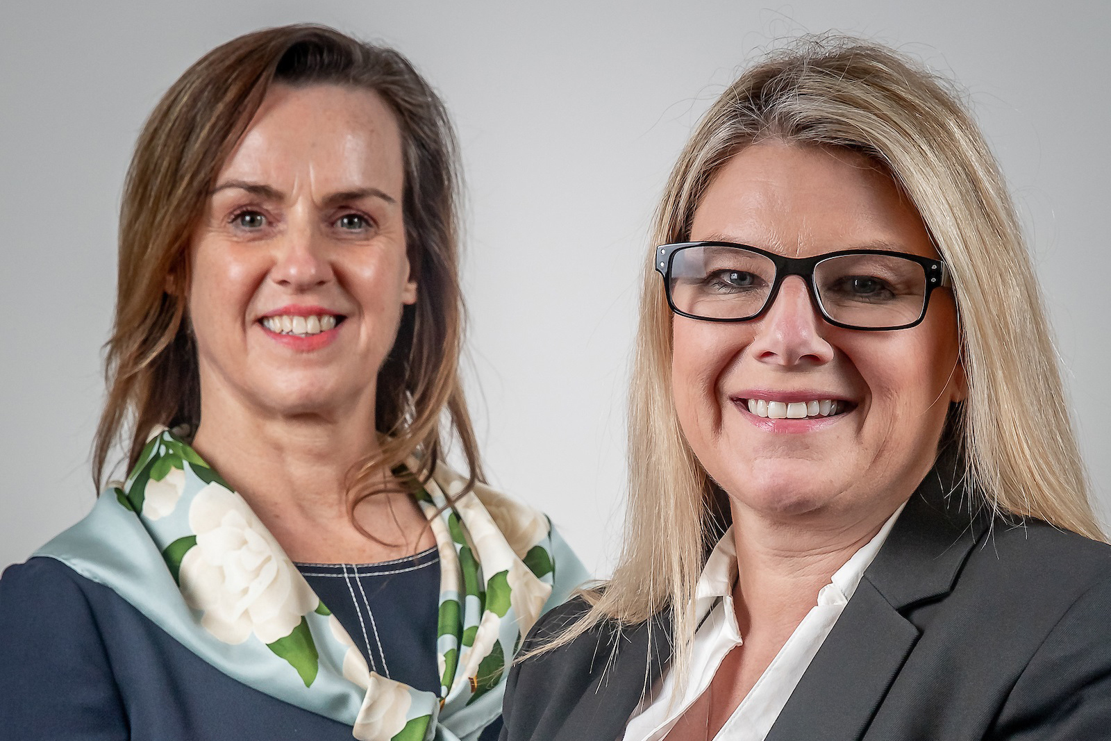 Ann Shannahan and Samantha Godwin smiling for professional photos