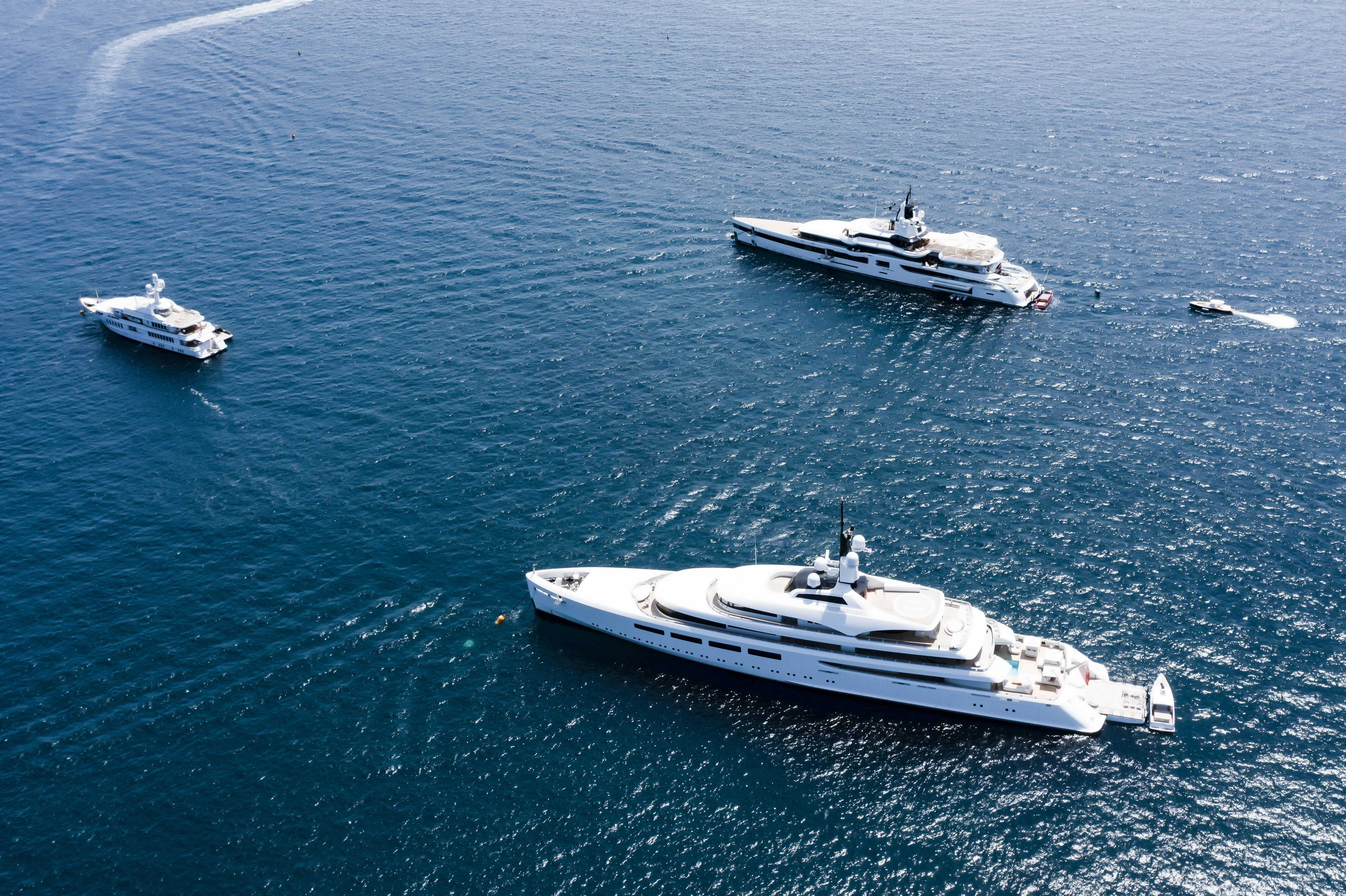 Three Yachts at Sea