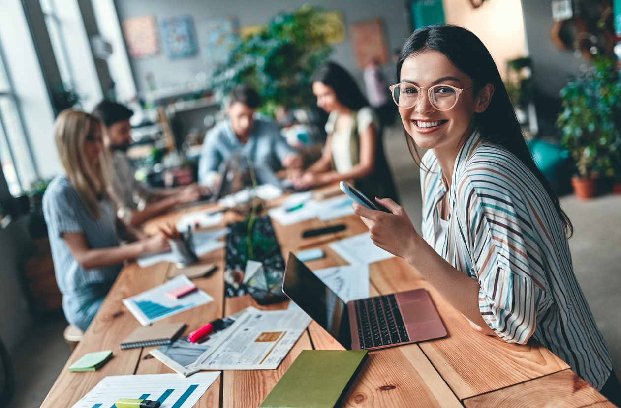 Group of young business people working together in modern office