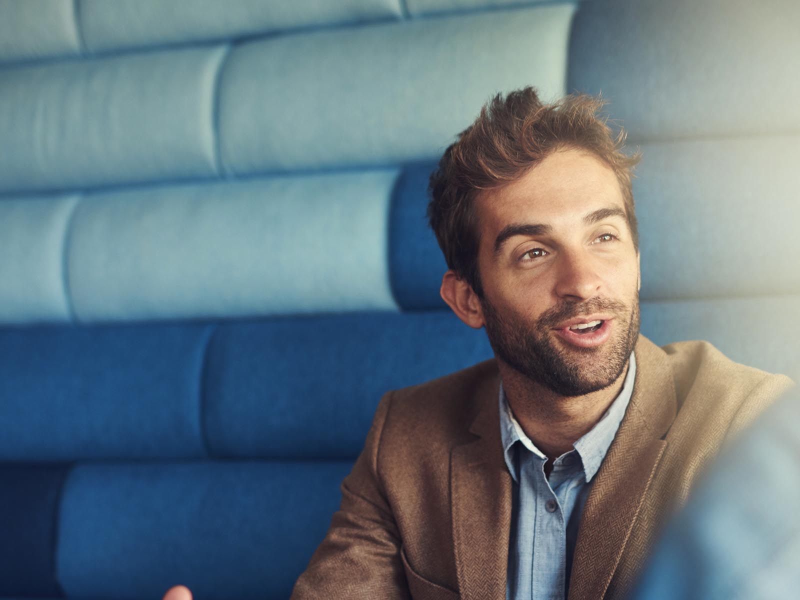 An image of a man with a beard having a discussion with someone behind the camera